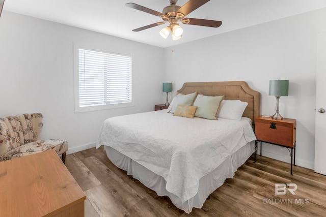 bedroom featuring hardwood / wood-style floors and ceiling fan