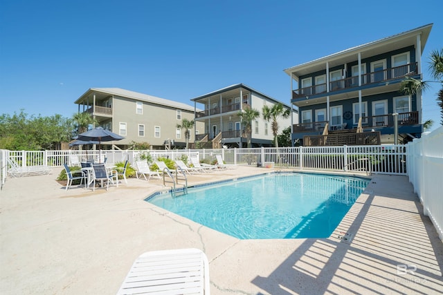 view of pool featuring a patio area