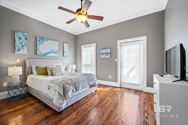 bedroom with ceiling fan, dark hardwood / wood-style floors, and ornamental molding