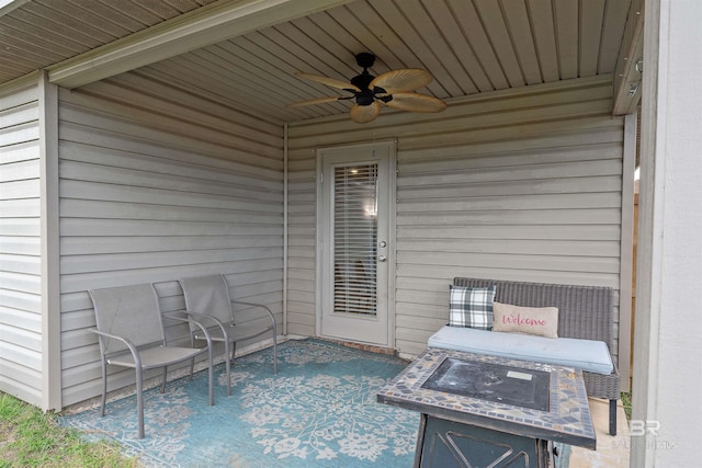 view of patio featuring ceiling fan