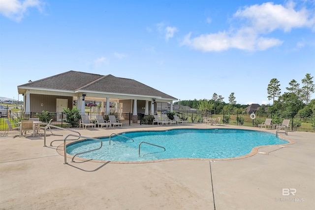 view of swimming pool with a patio