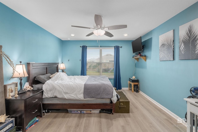 bedroom featuring light hardwood / wood-style floors and ceiling fan