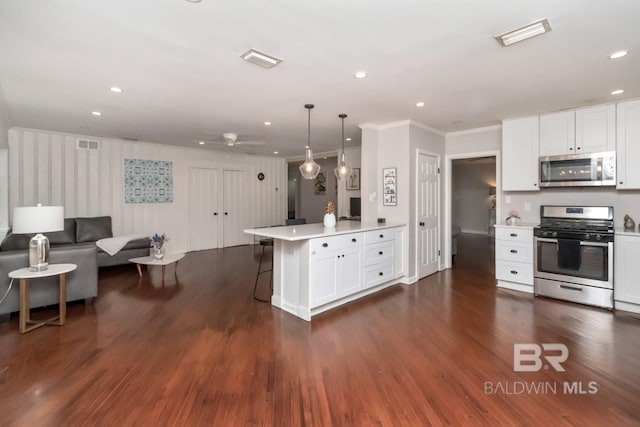 1 Elizabeth Pl, Mobile, AL 36606 - kitchen with appliances with stainless steel finishes, a peninsula, ornamental molding, light countertops, and open floor plan