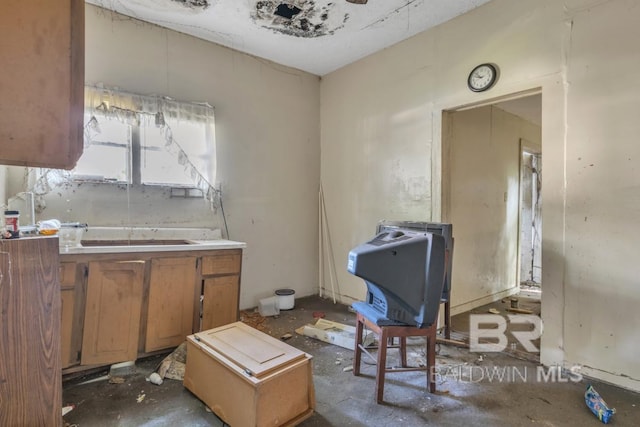 1310 Hercules St, Mobile, AL 36603 - kitchen featuring a sink and brown cabinets