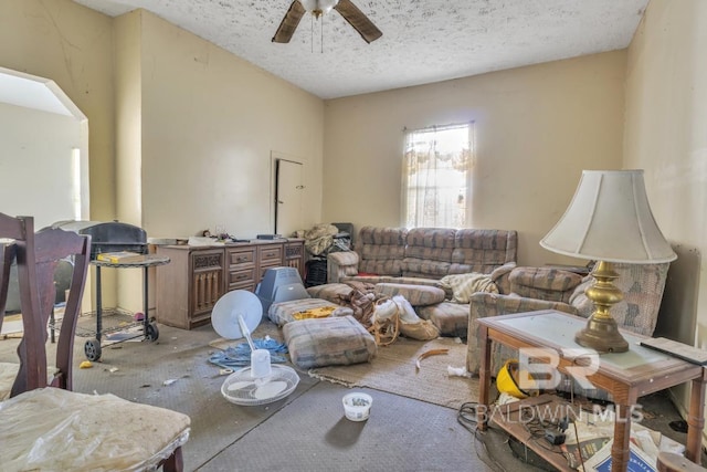 1310 Hercules St, Mobile, AL 36603 - living room with a ceiling fan, a textured ceiling, and arched walkways