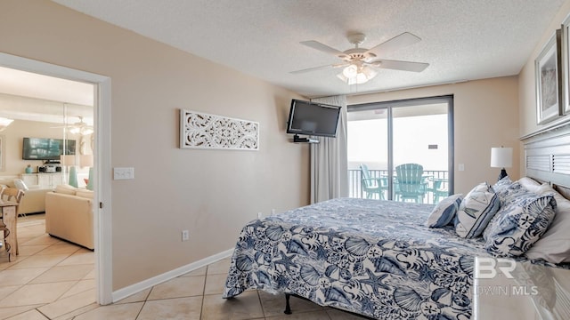 tiled bedroom featuring ceiling fan, access to exterior, and a textured ceiling