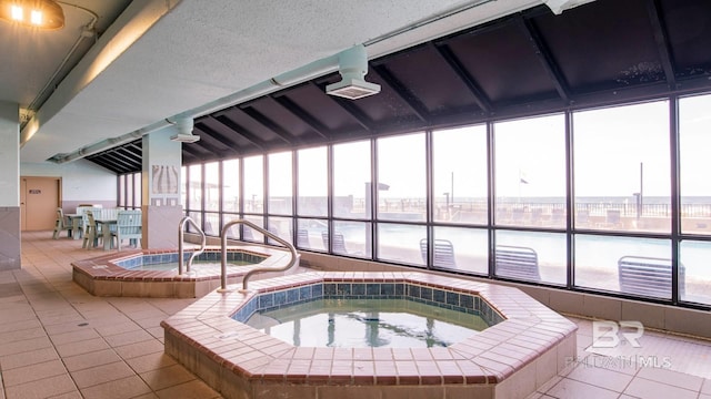 view of pool featuring an indoor hot tub