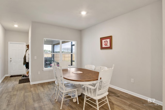 dining area with hardwood / wood-style floors