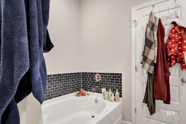 bathroom featuring a tub