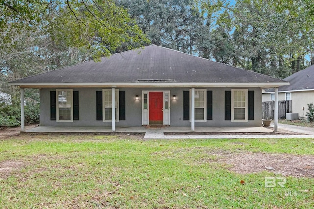 single story home featuring a front lawn and central air condition unit