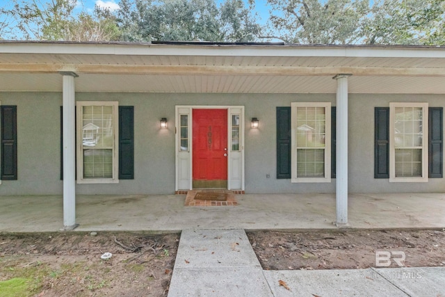 property entrance featuring a porch