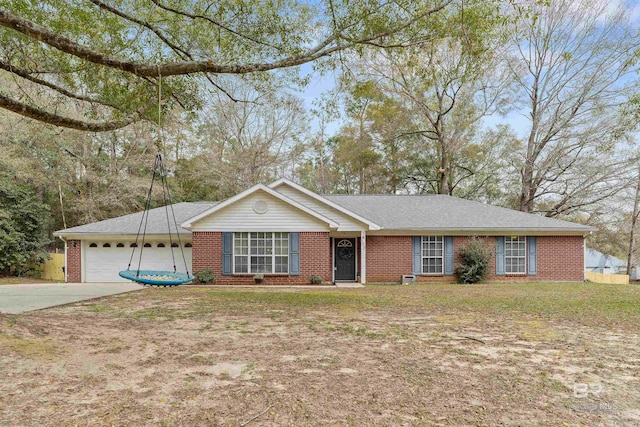 ranch-style house featuring brick siding, an attached garage, driveway, and a front yard