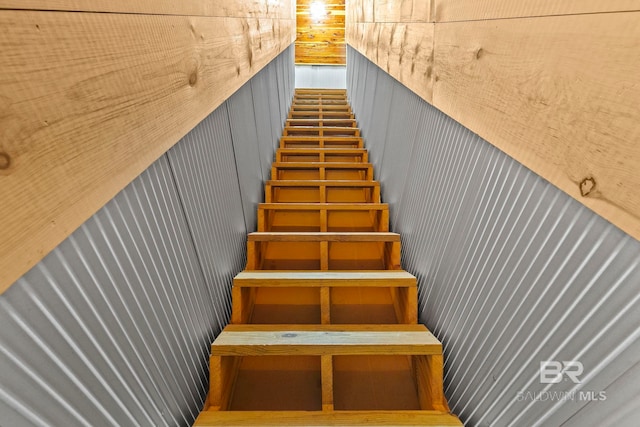 stairs with wood walls