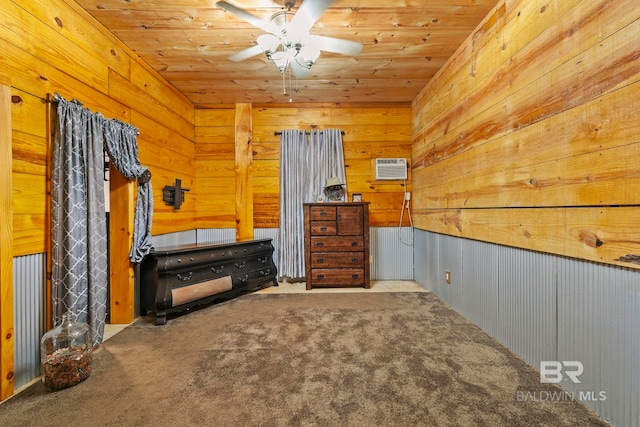 unfurnished bedroom featuring wood ceiling, a wall unit AC, carpet floors, and wooden walls