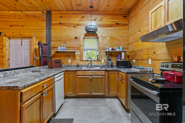 kitchen with electric range, wood walls, ventilation hood, and sink