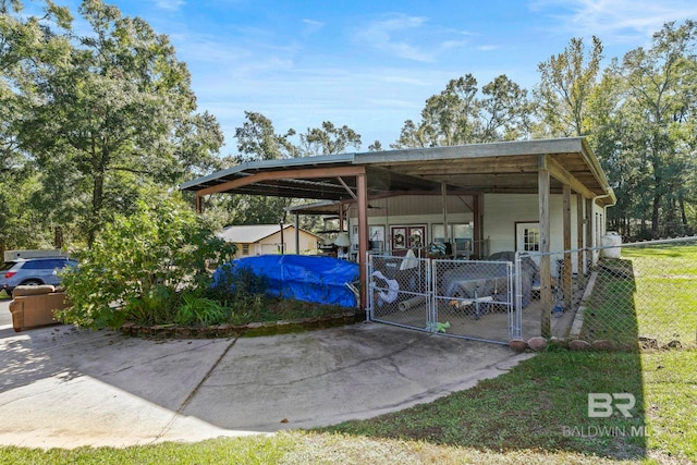 view of vehicle parking featuring a carport