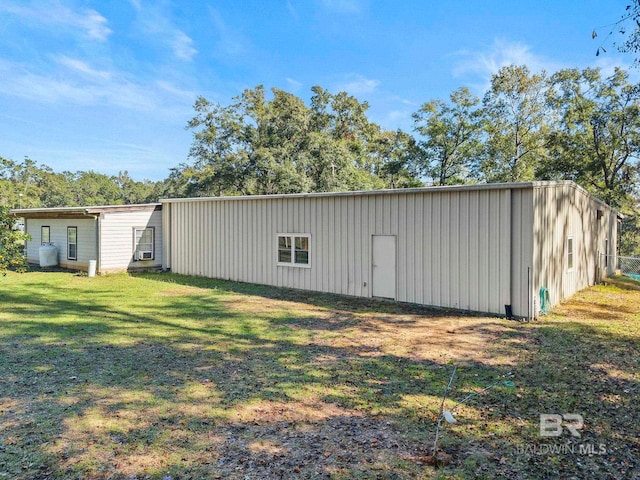 view of outdoor structure featuring a yard