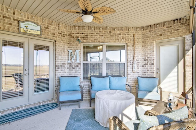 view of patio featuring ceiling fan and french doors