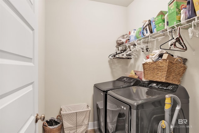 laundry area with separate washer and dryer