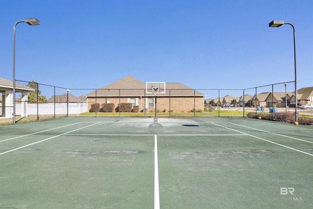 view of sport court with basketball hoop