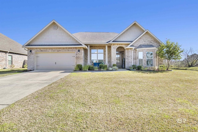 view of front of house featuring a front yard and a garage