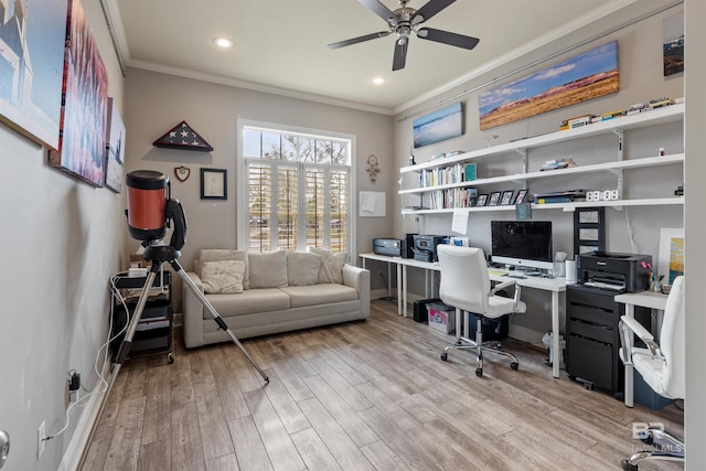 office space featuring ceiling fan, ornamental molding, and light hardwood / wood-style floors