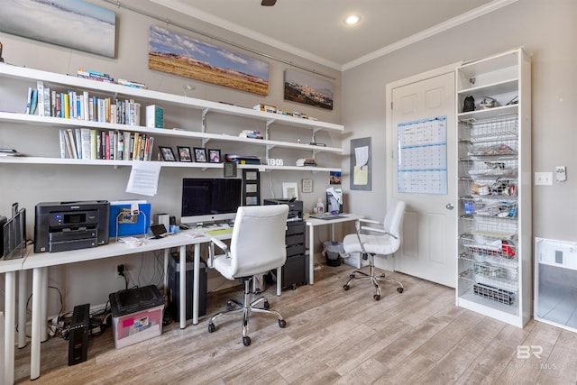 home office with hardwood / wood-style floors and crown molding