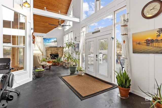 interior space with ceiling fan, french doors, wood ceiling, and plenty of natural light