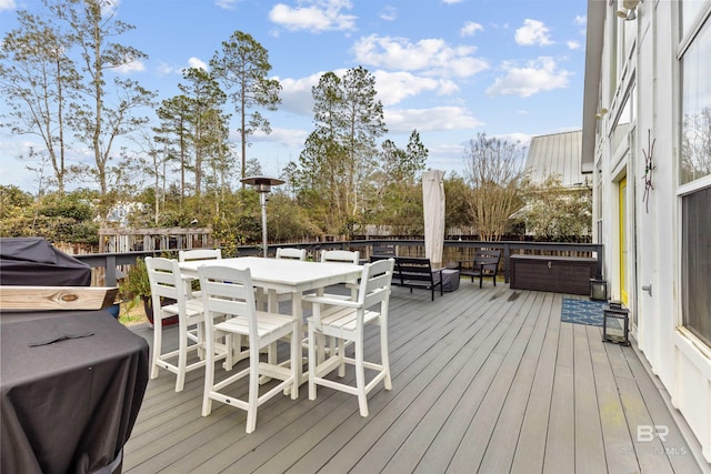 wooden deck with grilling area