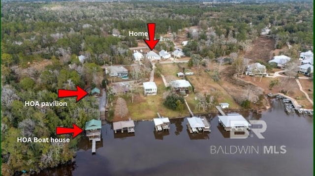 birds eye view of property with a water view