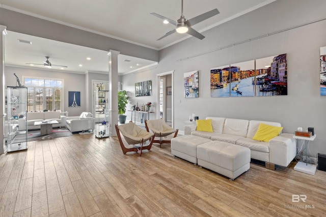 living room with ceiling fan, crown molding, and light hardwood / wood-style flooring