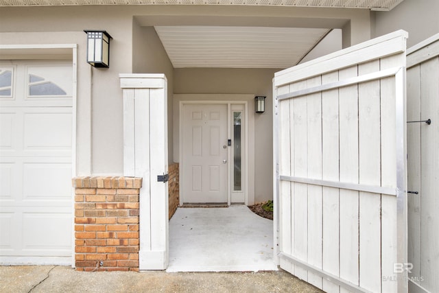 doorway to property featuring a garage