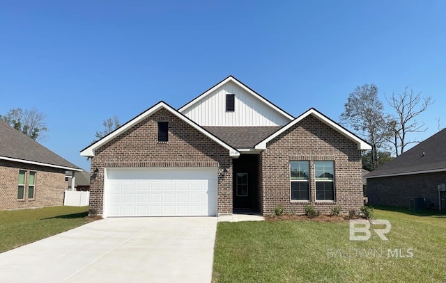 view of front facade with a garage, a front lawn, and central air condition unit