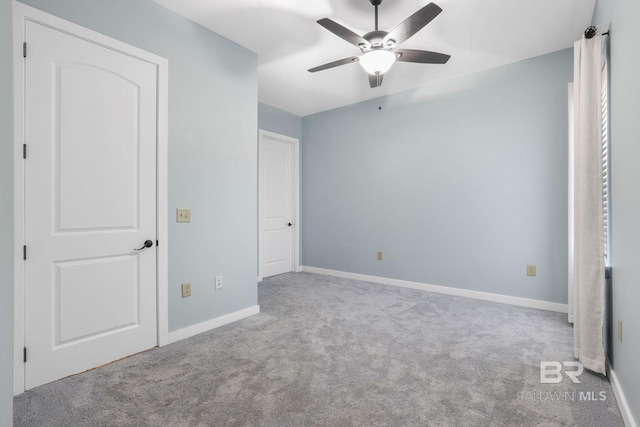 unfurnished bedroom with carpet and baseboards