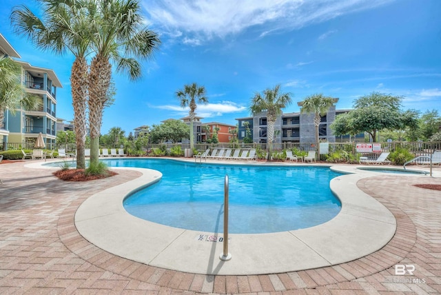 view of swimming pool featuring a patio area