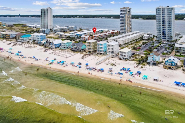 bird's eye view with a beach view and a water view