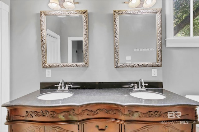 bathroom with double vanity and a sink