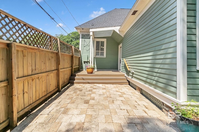 view of patio / terrace featuring fence