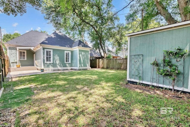 view of yard with a fenced backyard