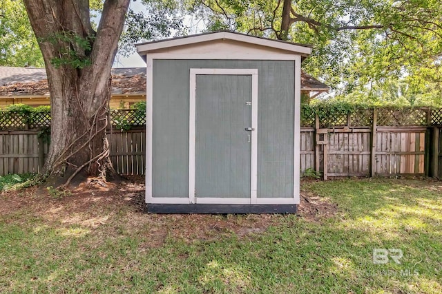 view of shed featuring a fenced backyard