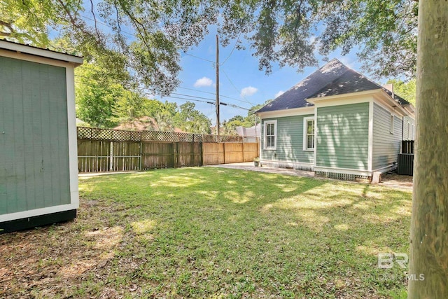 view of yard featuring an outdoor structure, a fenced backyard, and cooling unit