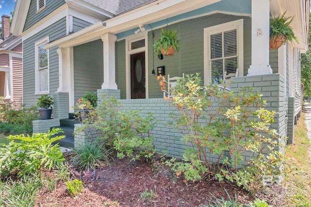 entrance to property with a porch