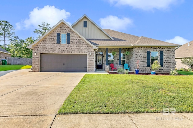 30635 Drayton Ct, Spanish Fort, AL 36527 - view of front of home with board and batten siding, driveway, brick siding, roof with shingles, and an attached garage