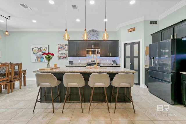 30635 Drayton Ct, Spanish Fort, AL 36527 - kitchen with appliances with stainless steel finishes, tasteful backsplash, light stone counters, a sink, and crown molding