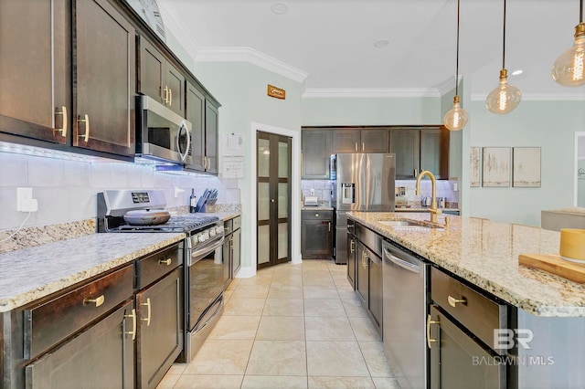 30635 Drayton Ct, Spanish Fort, AL 36527 - kitchen featuring appliances with stainless steel finishes, a sink, backsplash, crown molding, and dark brown cabinets