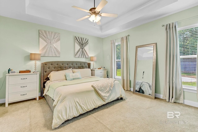 30635 Drayton Ct, Spanish Fort, AL 36527 - bedroom featuring a tray ceiling, light colored carpet, baseboards, ceiling fan, and crown molding