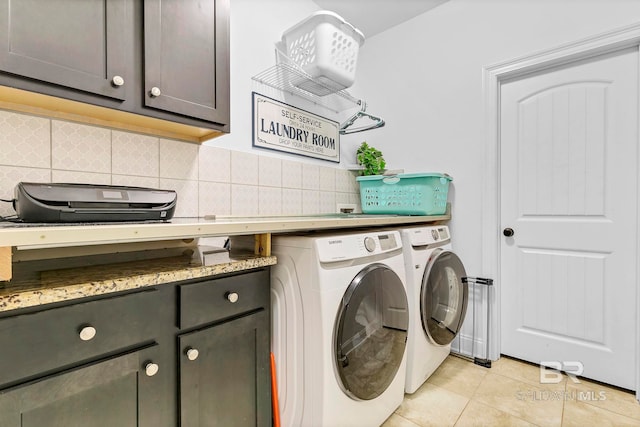 30635 Drayton Ct, Spanish Fort, AL 36527 - laundry room with separate washer and dryer, light tile patterned flooring, and cabinet space