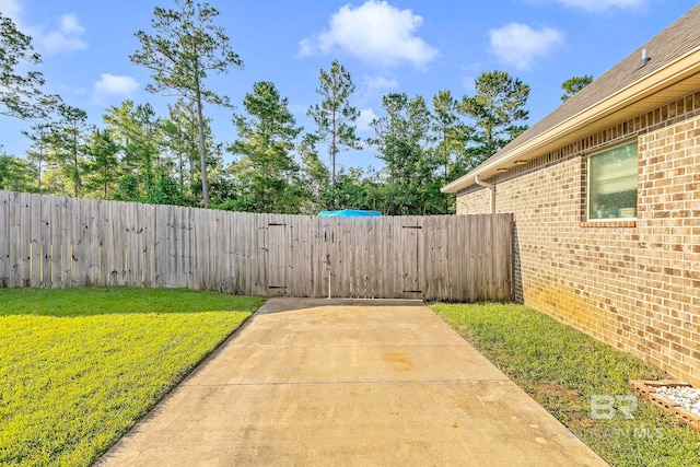 30635 Drayton Ct, Spanish Fort, AL 36527 - view of yard featuring a gate and a patio
