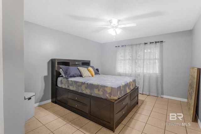 tiled bedroom with ceiling fan