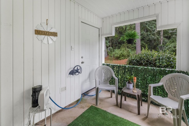 sunroom / solarium featuring a healthy amount of sunlight